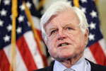 Sen. Edward Kennedy in front of the American flag